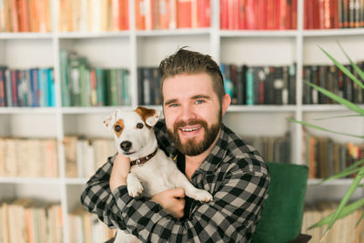 Portrait of smiling woman with dog