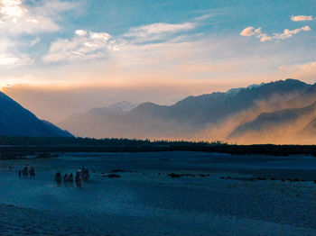 Sandstorm in himalayan desert at sunset