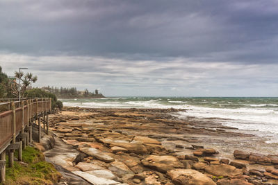 Scenic view of sea against cloudy sky