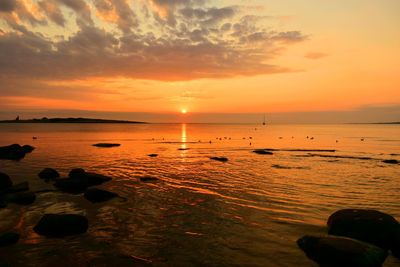 Scenic view of sea against sky during sunset