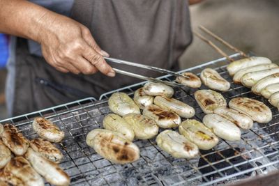 Midsection of man preparing food