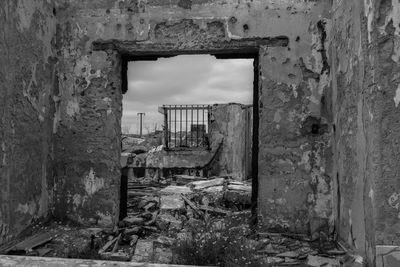 Abandoned building seen through window