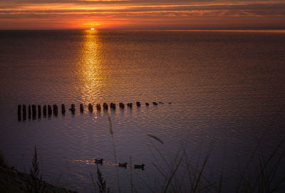 Scenic view of sea against sky during sunset