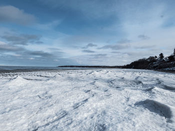 Scenic view of sea against sky during winter