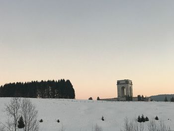 Scenic view of snow covered landscape against clear sky