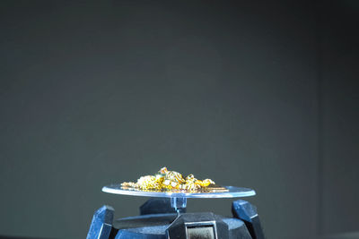 Close-up of food on table against wall