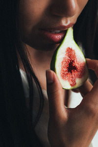 Close-up of woman holding fruit