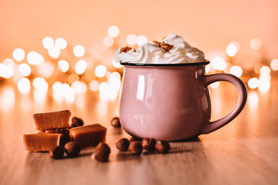 Close-up of coffee cup on table