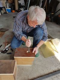 Carpenter working on wood at workshop