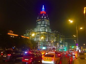 Cars moving on illuminated city at night