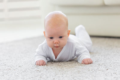 High angle view of baby boy on floor