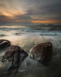 Scenic view of sea shore during sunset