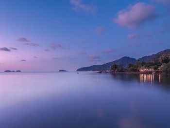 Scenic view of sea against sky at sunset