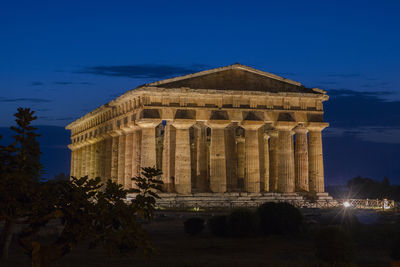 Temple against blue sky at dusk