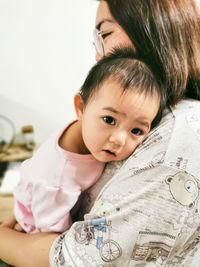 Portrait of cute baby girl at home