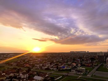 High angle view of buildings against sky during sunset