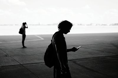 Full length of woman standing against sky