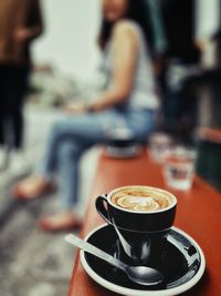 Coffee cup on table at cafe