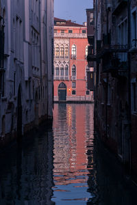 Canal passing through city buildings