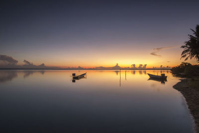 Scenic view of lake against sky during sunset