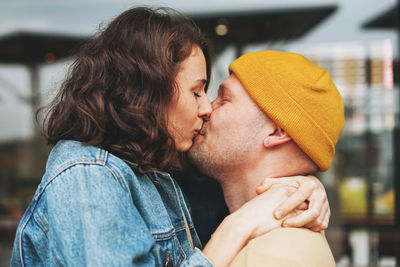 Side view of couple kissing