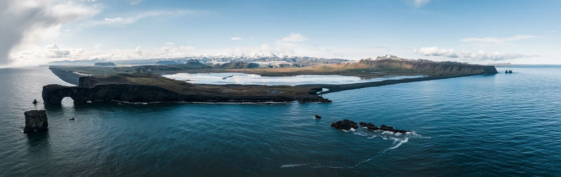 Iceland black sand beach with huge waves at reynisfjara vik.