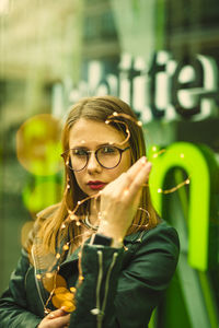 Close-up of young woman wearing eyeglasses