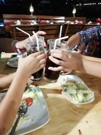 Group of people drinking glass on table