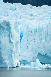 Glacial lake against snowcapped mountains