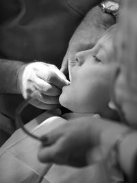 Dentist examining boy in hospital