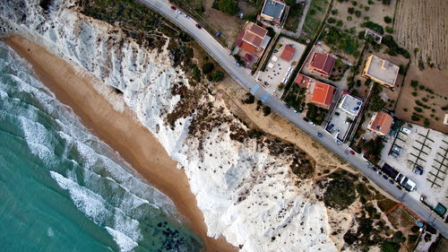 Aerial view of sea by buildings