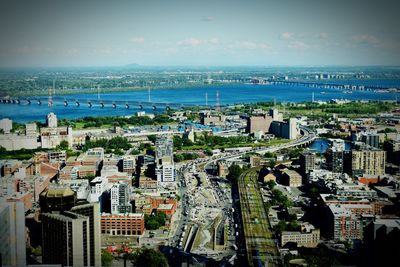 High angle view of buildings in city against sky