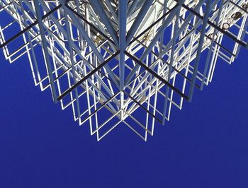 Low angle view of tree against blue sky