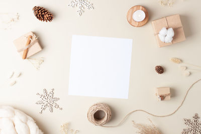 Directly above shot of christmas decorations on yellow background