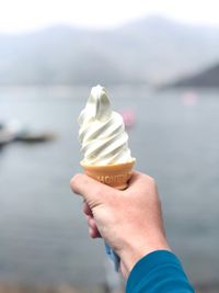 Hand holding ice cream cone