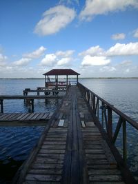 Pier over sea against sky