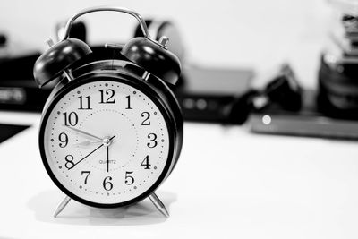 Close-up of clock on table