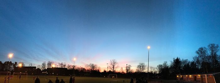 Panoramic view of trees against sky at night