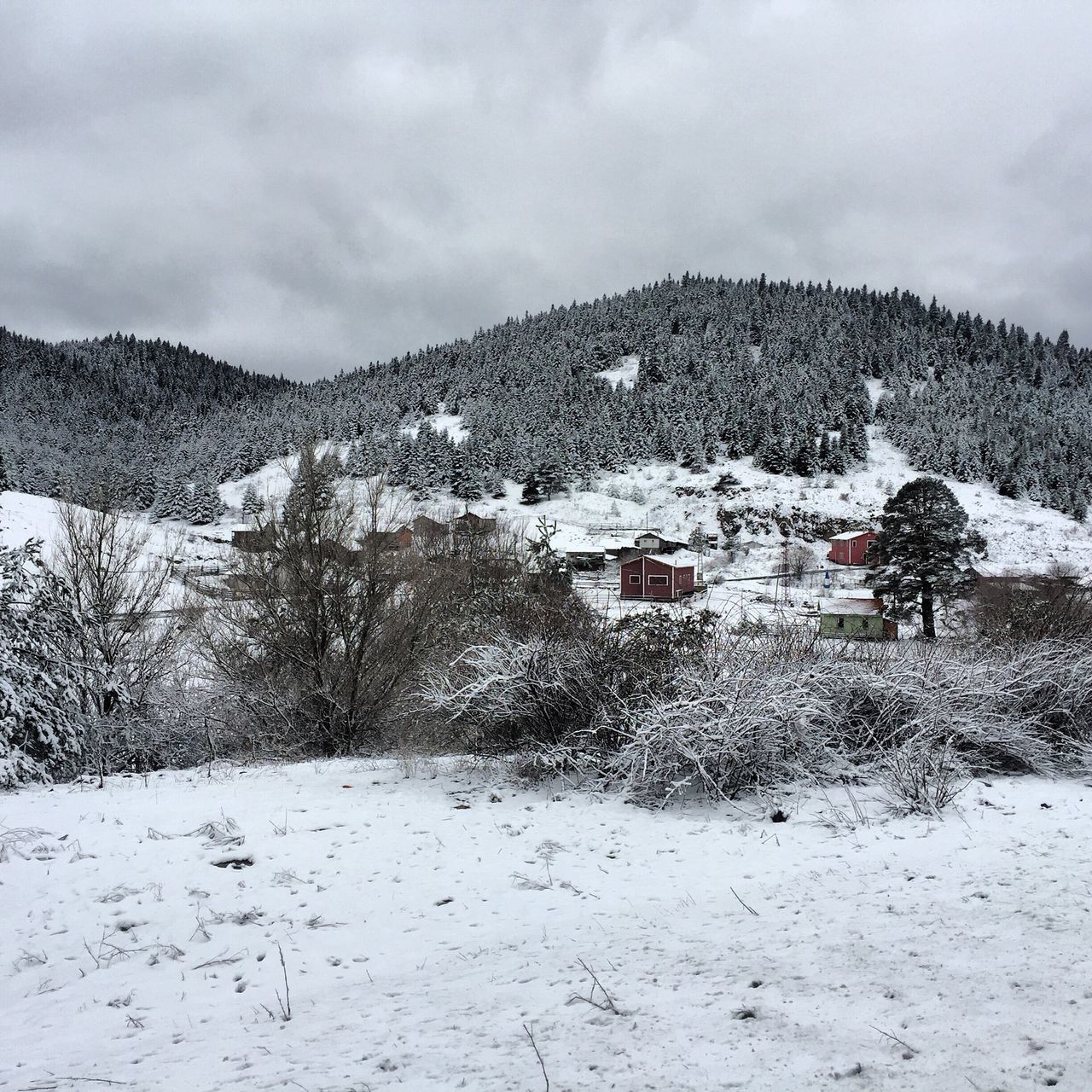 snow, mountain, winter, cold temperature, sky, weather, cloud - sky, landscape, season, built structure, tranquility, building exterior, architecture, tranquil scene, nature, house, mountain range, scenics, beauty in nature, cloudy