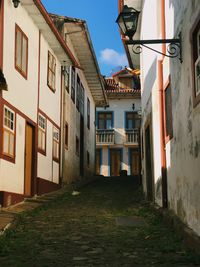 Narrow alley amidst houses in town