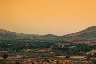 Scenic view of field against clear sky