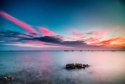 Scenic view of sea against sky at sunset
