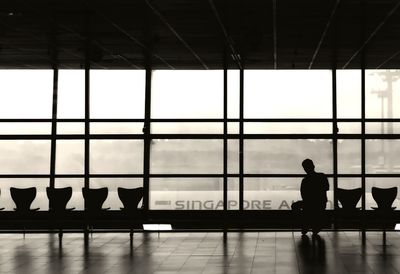 Silhouette of people at airport