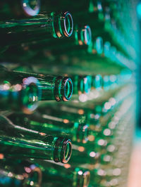 Close-up of wine bottles on glass