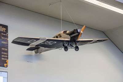 Low angle view of airplane flying against sky