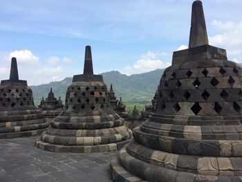 View of temple against cloudy sky