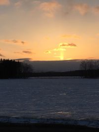 Scenic view of landscape against sky during sunset