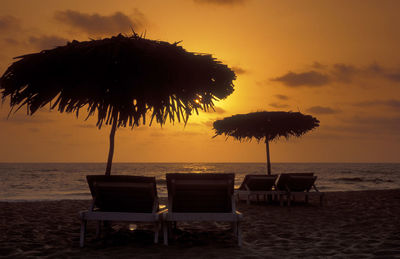 Scenic view of beach against sky during sunset