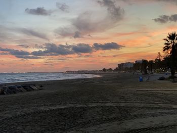 Scenic view of beach against sky during sunset