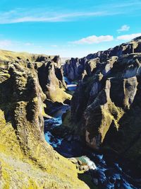 Panoramic view of rocks in sea against sky